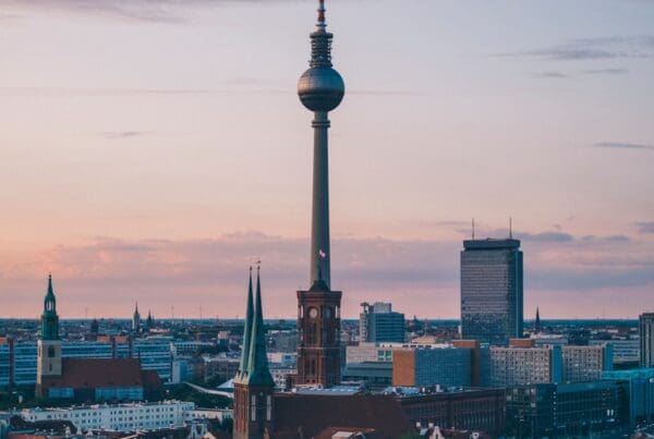 needle tower among small buildings