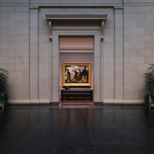 black fireplace in front of white concrete building